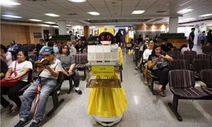 Chinese robots deliver files pills in Bangkok hospital (c) Xinhua